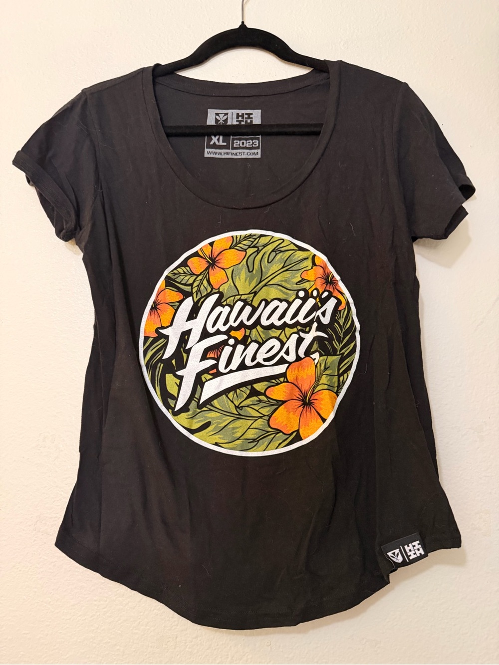 Hawaii's Finest Black Tee with Orange Floral Logo